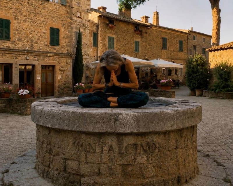Seated in meditation on a stone well carved with the name Montalcino, among stone houses